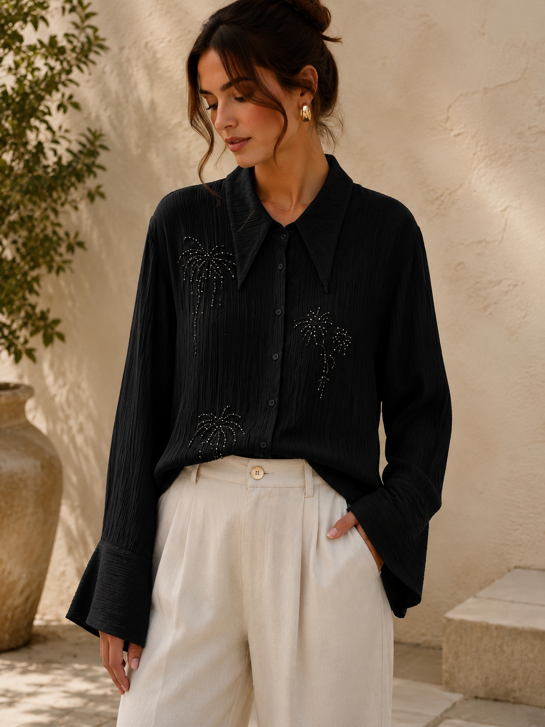 Blus med glittrande broderier