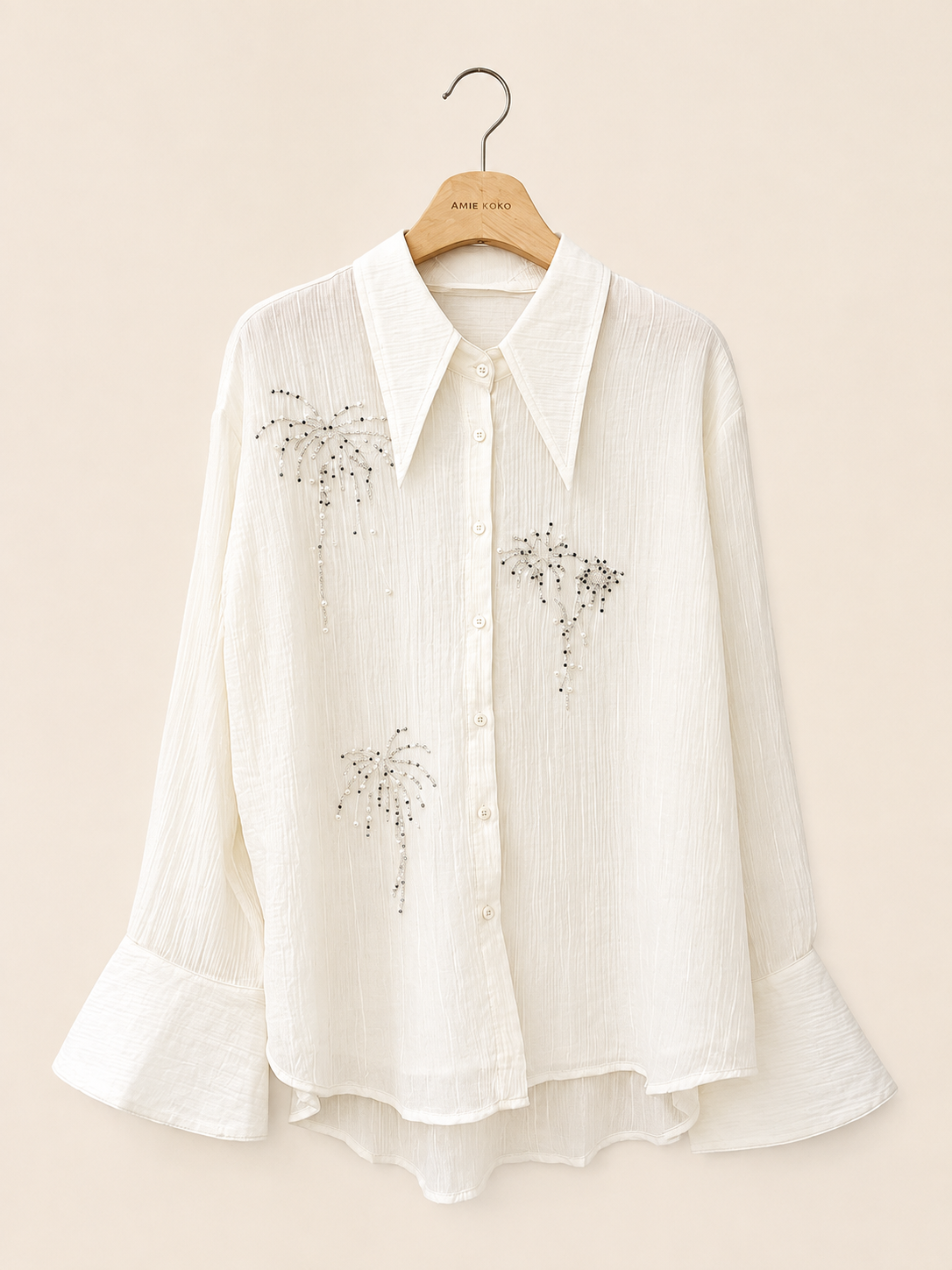 Blus med glittrande broderier