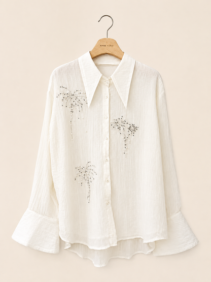 Blus med glittrande broderier