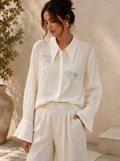 Blus med glittrande broderier