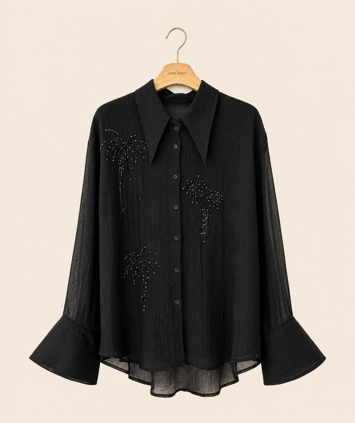 Blus med glittrande broderier