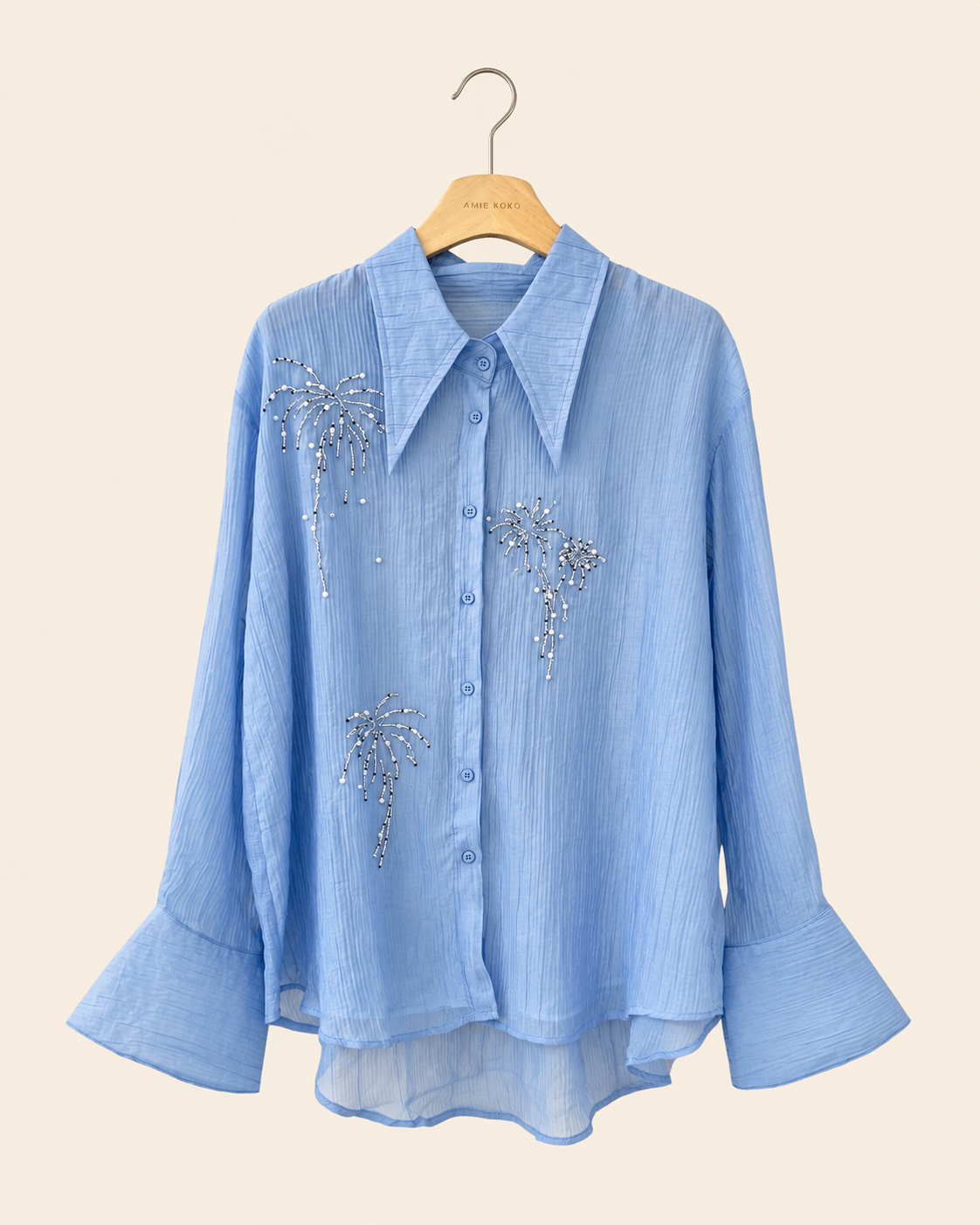 Blus med glittrande broderier